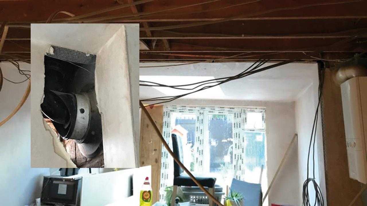 Builders fined for unsafe construction around boiler flue image